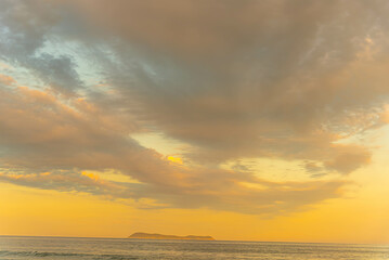 Rain clouds in the late afternoon at Gamboa Beach, Santa Catarina, Brazil.