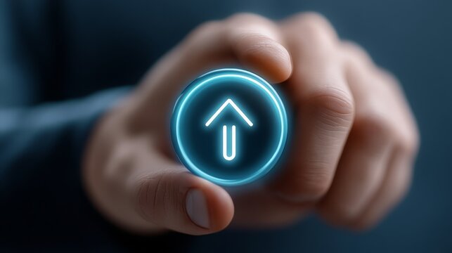 Closeup of hand activating a circular button with an arrow symbol