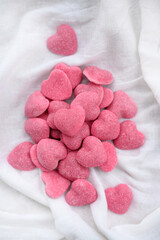close-up of pink heart-shaped candies isolated on white. sweet candies. Valentine's Day background