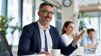 confident business professional in suit is giving clear instructions to colleagues in modern open plan office, fostering collaborative atmosphere