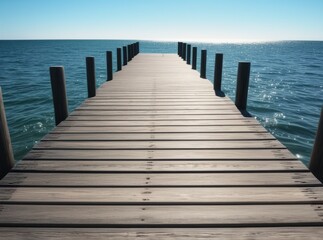 Beautiful wooden pier extends into calm blue waters under sunny sky at midday