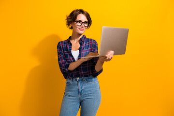 Photo of intelligent focused woman with bob hair dressed plaid shirt in eyewear read email on...