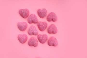 Obraz premium Pink heart candy on pink background. Save for text. Valentine's Day background