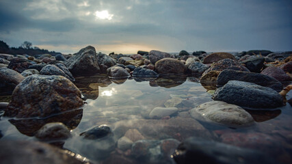 Reflection of stones and sky in the water