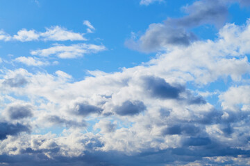 Sun rays playing on the clouds create a magical effect in the sky.