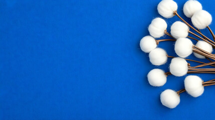 White Cotton Balls on Blue Background Illustration