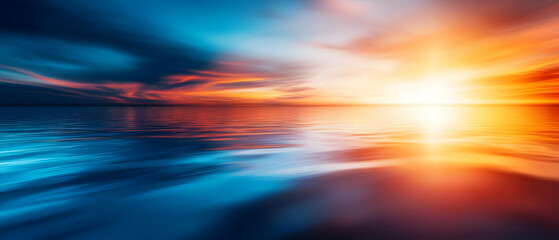 A stunning sunset over a calm water surface, showcasing vibrant colors blending in the sky and reflections.