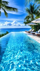 Clear blue water in a modern pool with palm trees. A serene pool surrounded by lush tropical beauty