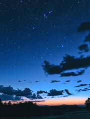 Fototapeta premium Starry night sky with clouds, night sky filled with stars, blue background, sky with moon and planets