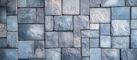 Fototapeta premium Contemporary Textured Gray Cubic Stone Pavers Backdrop with Neutral Tones and Empty Space for Branding or Design Elements