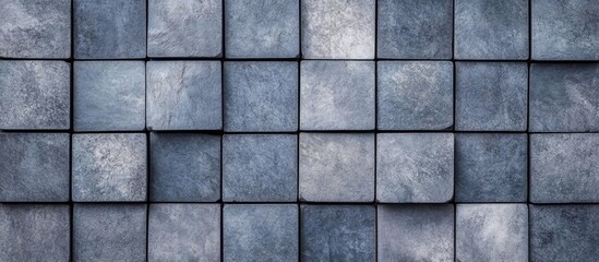 Textured Gray Cubic Stone Pavers Background with Varied Tones and Empty Central Space for Text Placement in Urban Design Context