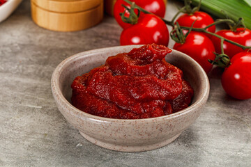 Red tomato paste in the bowl