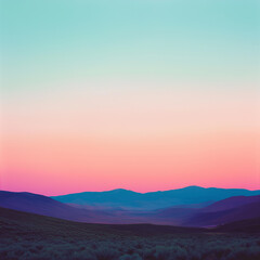 Fototapeta premium stunning pastel-colored sunset over rolling mountain Landscape, soft pink and blue sky creating dreamy, peaceful, and atmospheric natural scenery for relaxation and tranquility