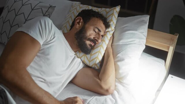 Handsome man sleeping in bed in a cozy bedroom with soft lighting and comfortable pillows