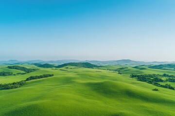 Fototapeta premium aerial view of thriving sustainable farm surrounded by natural landscapes and green hills under clear sky overall composition