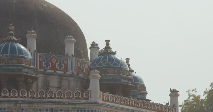 New Delhi, Delhi, India. Doves birds sitting on Isa Khan's Tomb near The Humayun's tomb. Famous place is Tomb of Mughal emperor, Mirza Nasir al-Din Muhammad commonly known as Humayun situated in Delhi