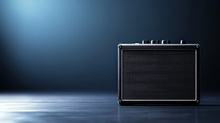 Black guitar amplifier with blue light in background and sound controls on front panel