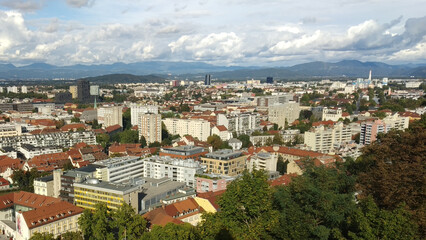 Obraz premium View on buildings and mountains of city Ljubljana, Slovenia, from the Ljubljana Castle
