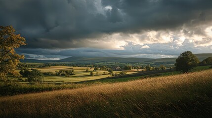 Obraz premium Dramatic Storm Clouds Over Rolling Countryside