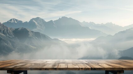 Wooden table with mountain and fog backdrop for product display.
