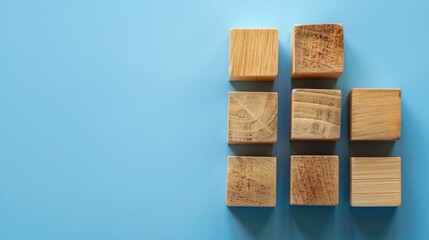 Preview message on wooden blocks with blue background. Abstract sneak peek symbol. Empty area.