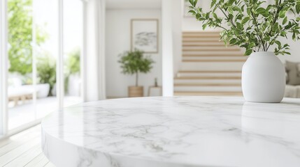 Modern Minimalist Marble Tabletop with Greenery and Blurred Background