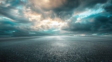 Fototapeta premium Dramatic Clouds Over Empty Dark Asphalt Street Horizon