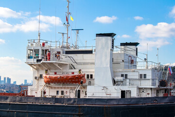 Cabins of a dry cargo ship passing through the Bosphorus. Orange lifeboat. Maritime trade idea...