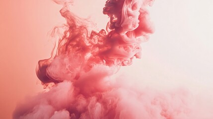 Pink ink swirling in water creating abstract shapes and clouds