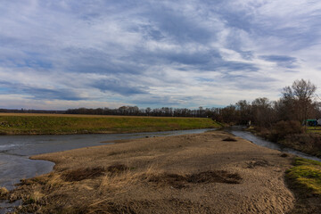 River and rafting on the Jihlava River near Cvrcovice. There are pieces of fallen trees in the river