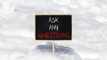 Ask any questions symbol. Concept words Ask any questions on beautiful black yellow blackboard. Beautiful white snow background. Business ask any questions concept. Copy space.