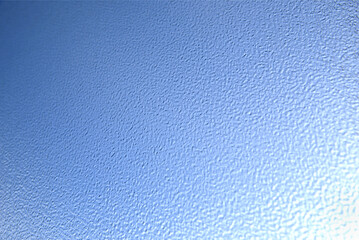 Opaque textured glass in front of blue sky