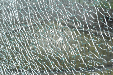 Thick, splintered, broken glass. Front view shot