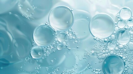 Light blue abstract background with oil circles and water bubbles macro view.