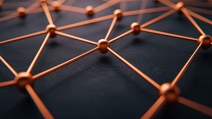 close up view of abstract network structure with interconnected copper nodes and lines on dark surface, symbolizing connectivity and digital communication