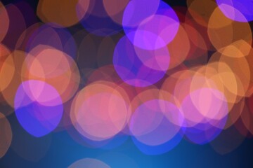 Blurred view of colorful lights on dark blue background, bokeh effect
