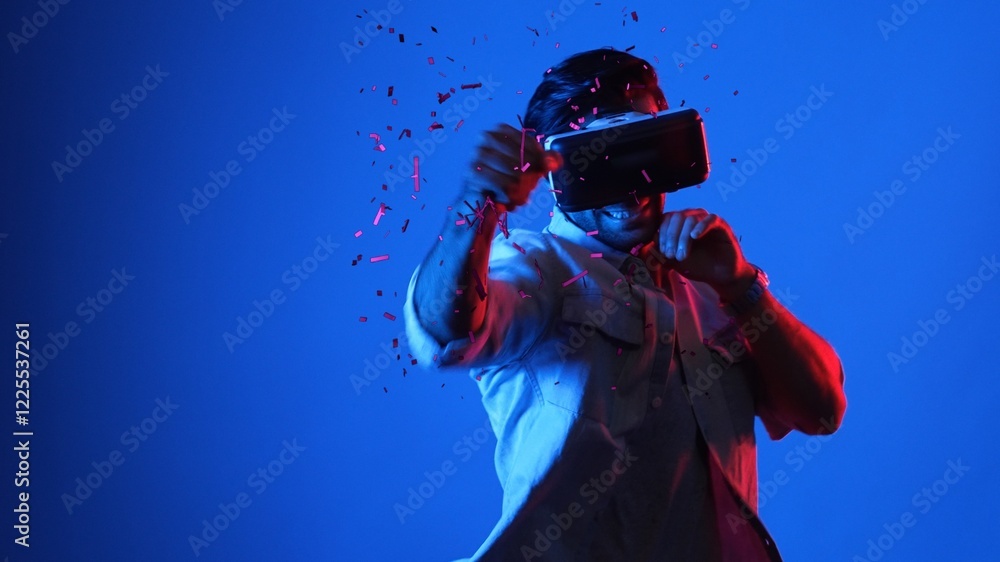 Poster skilled gamer boxing and punching floating box while wearing vr glasses to connect metaverse. male m