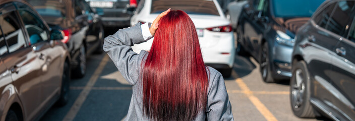 Surprised woman in the parking lot, her car was stolen