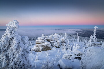 Winter landscape of Šumava. Beautiful landscape picture. Nature of Šumava. Czech Republic. Winter motif. Snowy region. Sunrise over the mountains. 