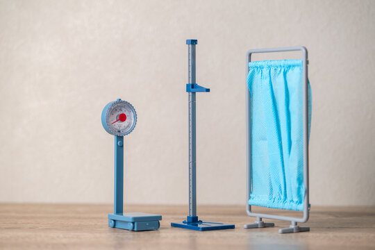 Toy weight scale and stadiometer.
Healthcare setting image.