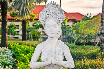 Traditional balinese statue in a public park.