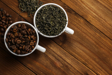 Coffee beans and tea leaves on table. Spices. Concept of taste and choice                      