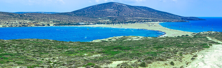 Panoramic view of Prasonisi, Crete, where two seas meet. Scenic landscape featuring the isthmus, sandy beaches, and turquoise waters. Popular destination for windsurfing and kitesurfing.
