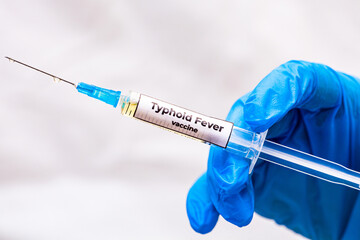 Vaccination healthcare concept. Hands of doctor or nurse in medical gloves with medical syringe...