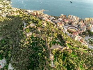 Aerial view of Malaga Alcazaba and Gibralfaro castle, crenellated wall, parapet and towers on a...