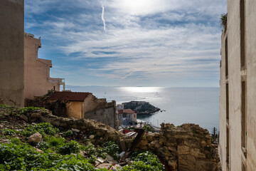 View of the sea from the top of the  Kastella cliff at Piraeus-Greece on a sunny day with clouds at the sky.