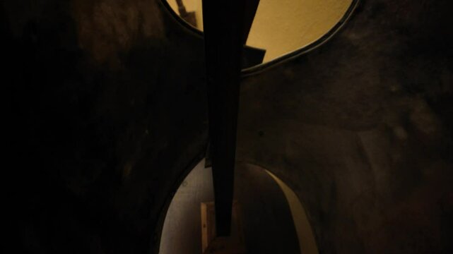 Displaying an old metal breastplate and helmet on a wooden stand inside Dozza Castle, revealing a fascinating glimpse into medieval history and heritage in Italy