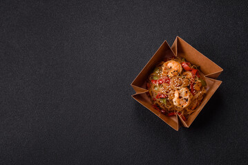 Glass noodles with shrimps and seafood, vegetables, spices and soy sauce