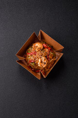 Glass noodles with shrimps and seafood, vegetables, spices and soy sauce