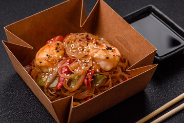 Glass noodles with shrimps and seafood, vegetables, spices and soy sauce